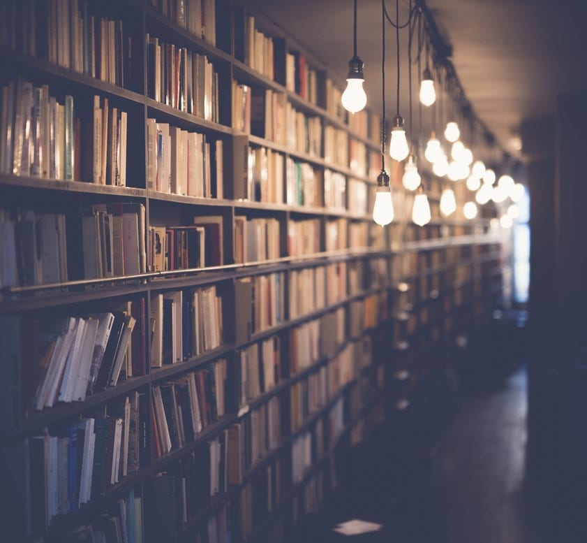 bookshelf with light bulbs shining,