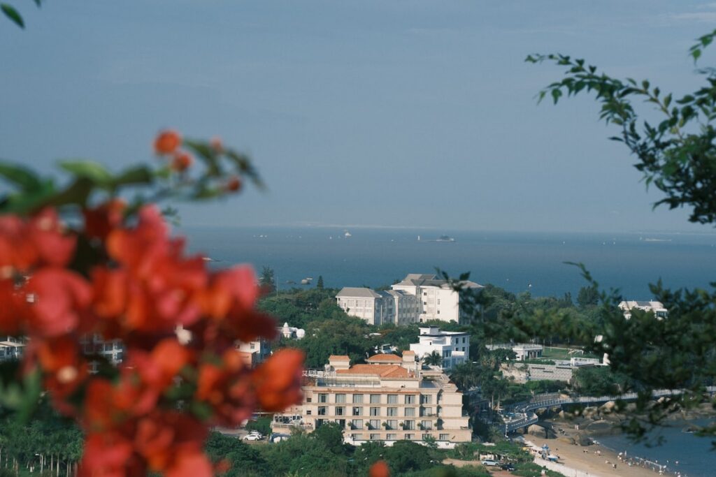 Coastal town with buildings overlooking the ocean travel