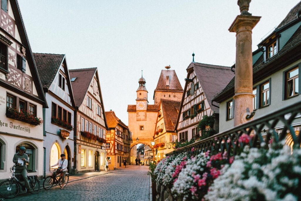 Cobbled old town street with timber-framed houses and flowers