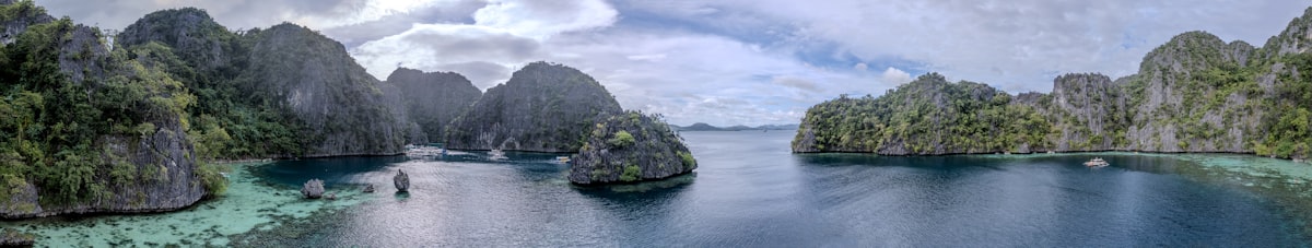 Jagged limestone islands in calm blue ocean