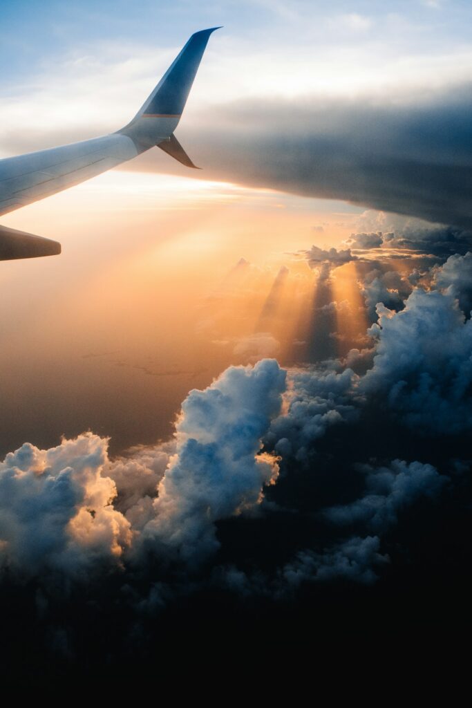 View of clouds and sunset from an aeroplane window